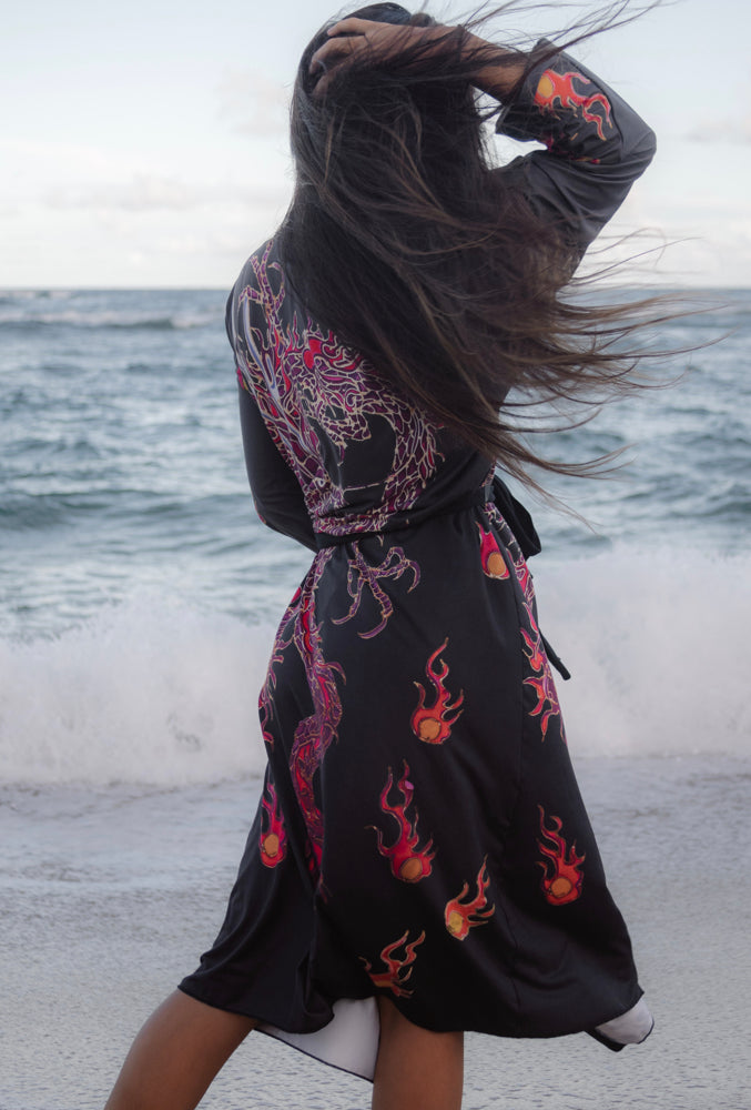 A model looking away at beach, wearing the Red Dragon Raising Japanese Long Kimono Robe